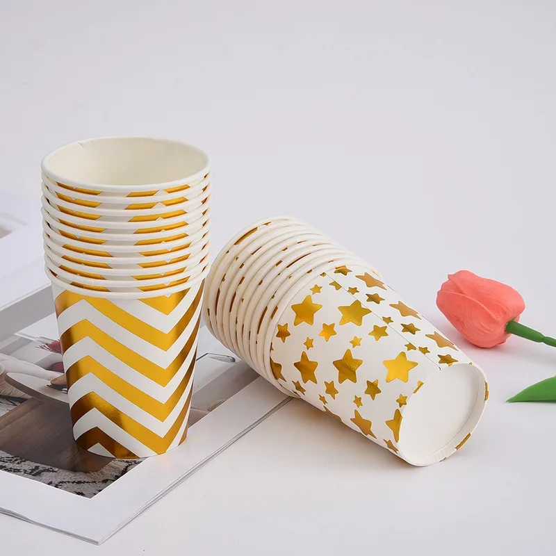 Gold chevron and star paper cups with a stack lying on its side