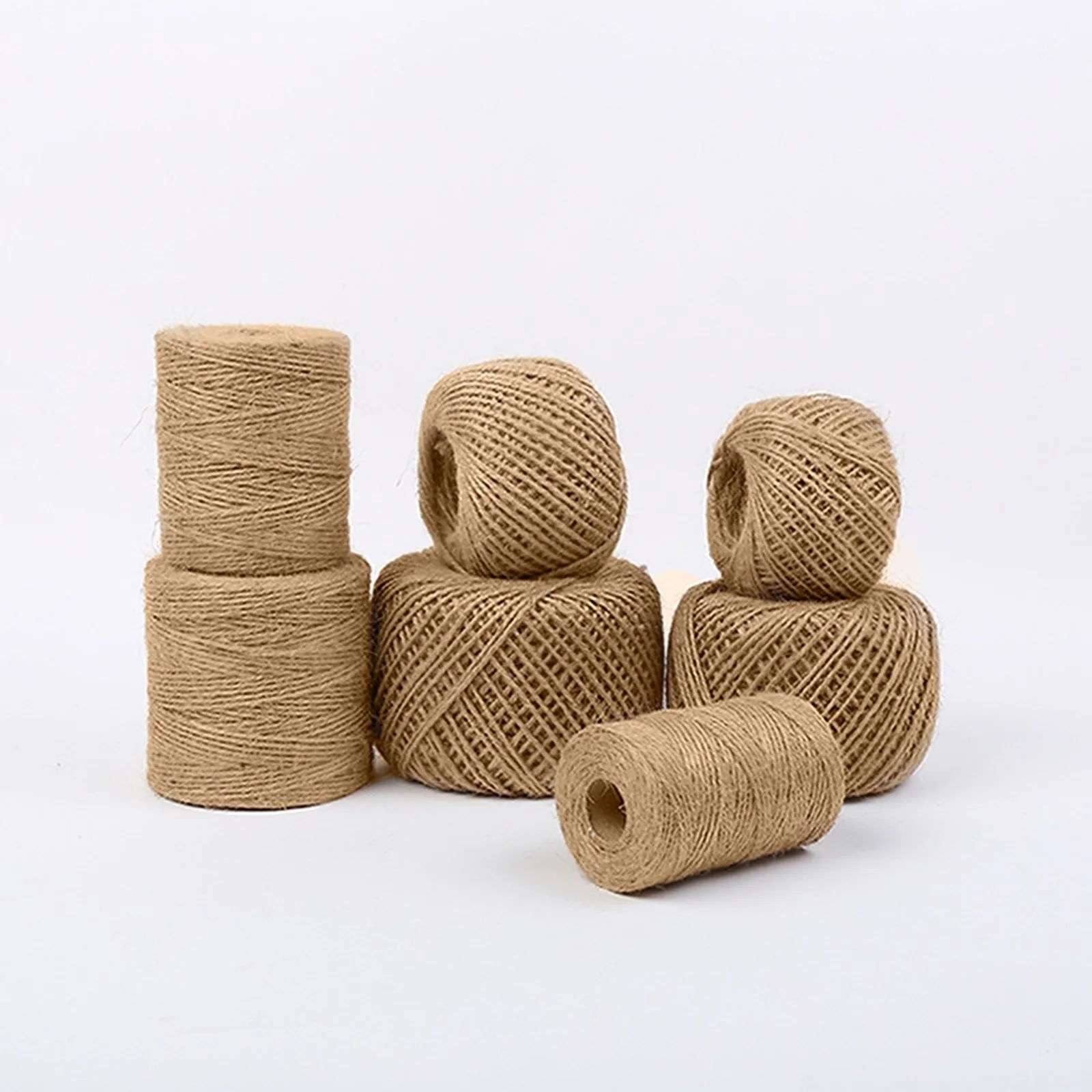 Jute twine in balls and spools on a white background