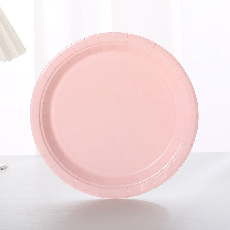 Light pink 7 inch paper plate standing upright