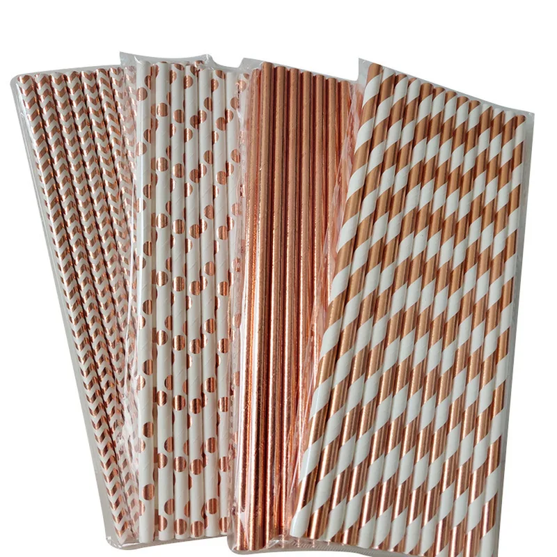 Four bags of rose gold paper straws in different patterns