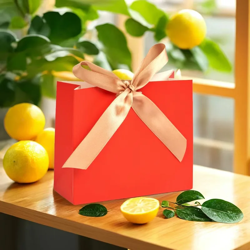 Red mini gift bag tied with a gold satin bow