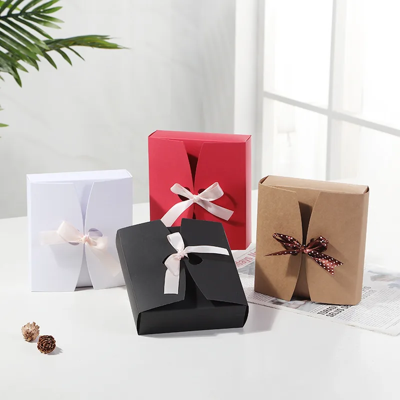 White, red, black and kraft gift boxes with bows