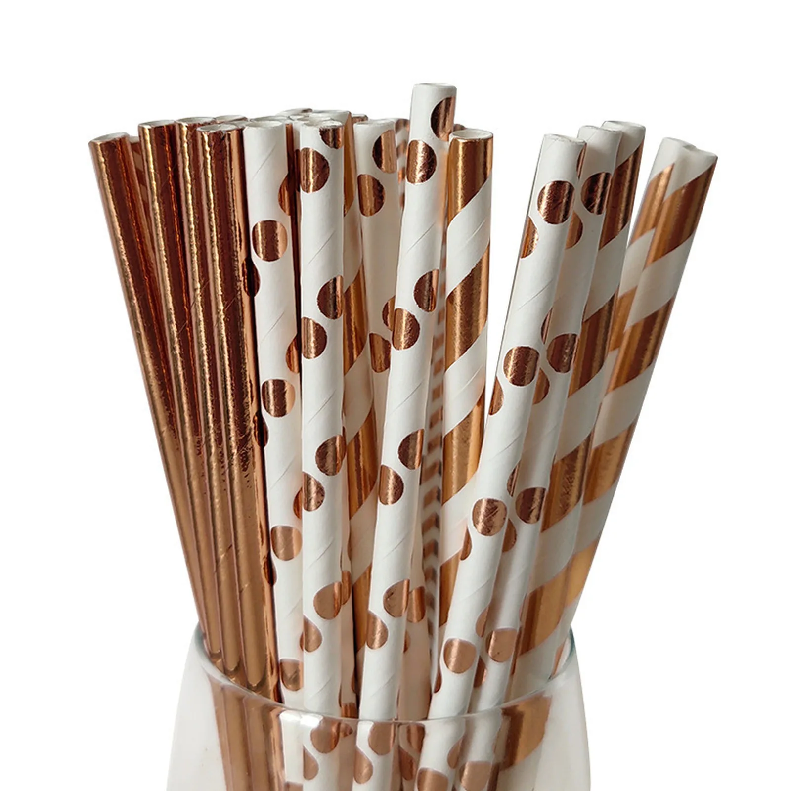 Rose gold foil paper straws in mixed patterns standing in a glass