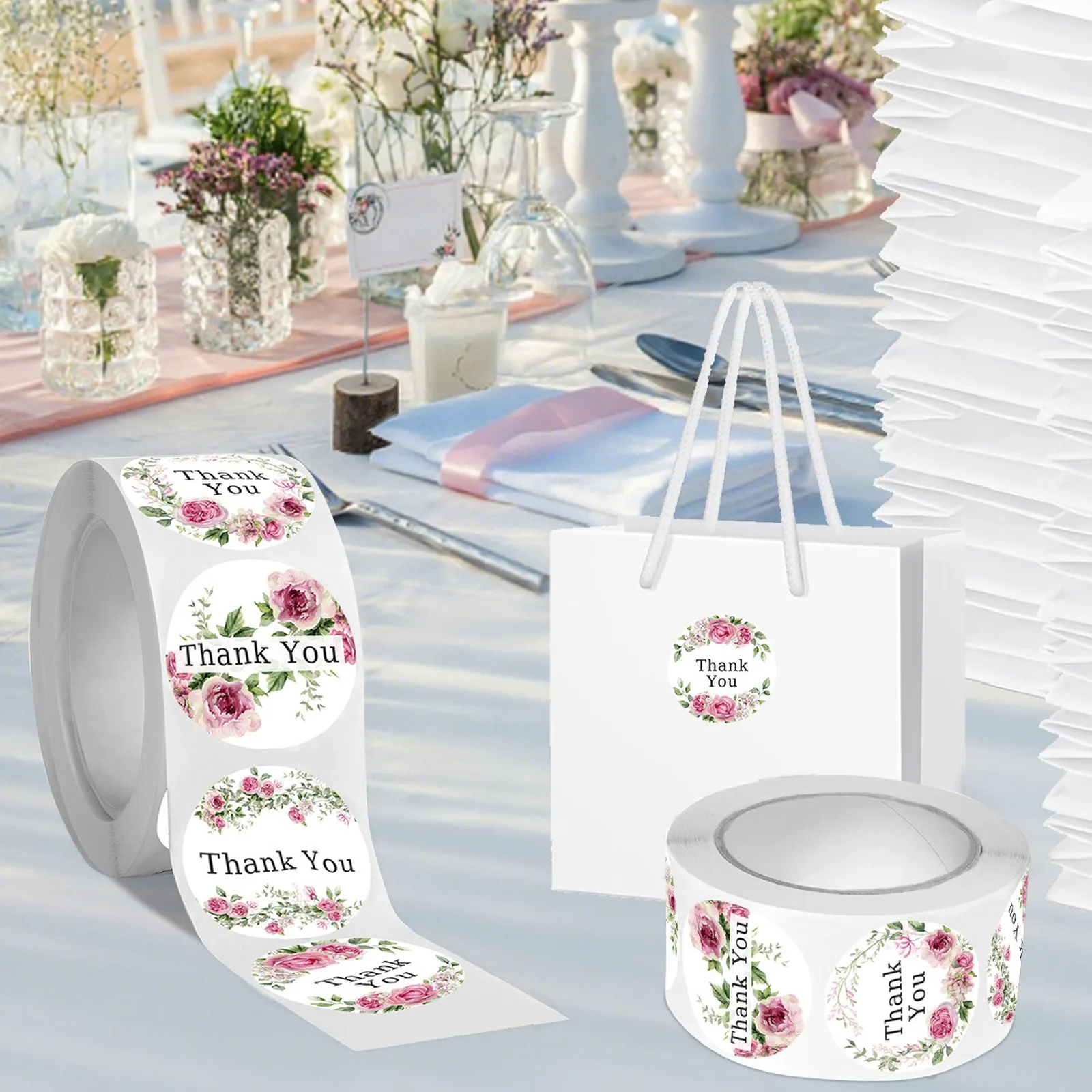 Roll of floral Thank You stickers on a wedding table