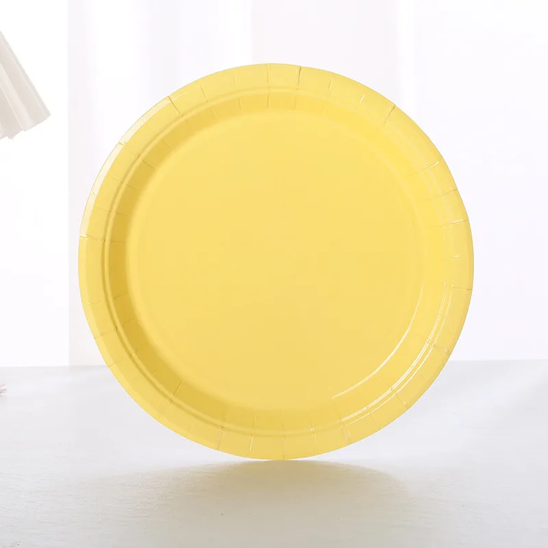 Yellow 7 inch paper plate standing upright