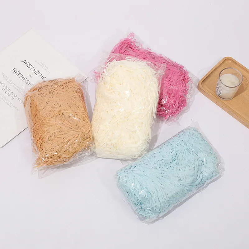 Bags of crinkle paper shred in kraft, ivory, pink and blue