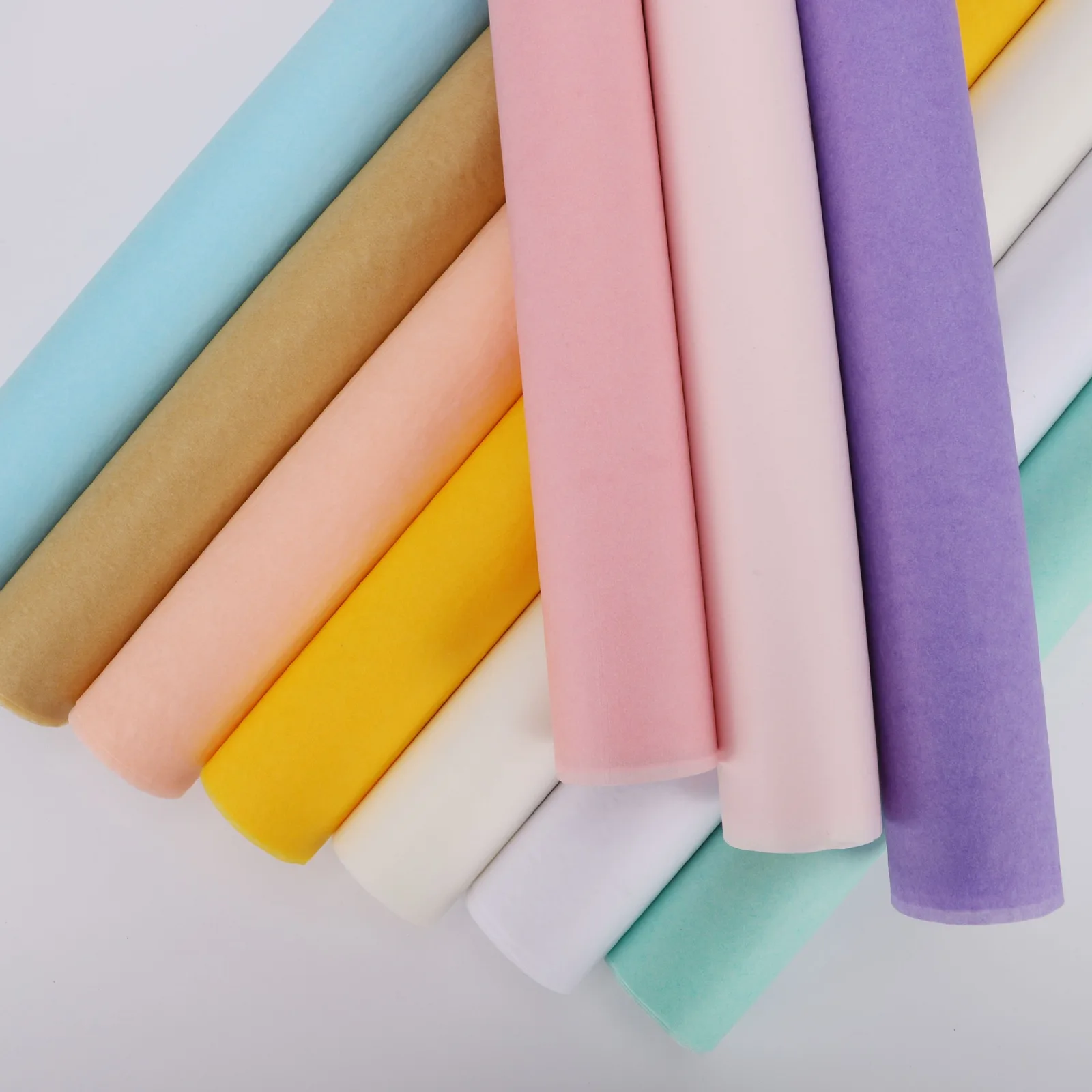 Rolled tissue paper sheets in pastel and kraft colors