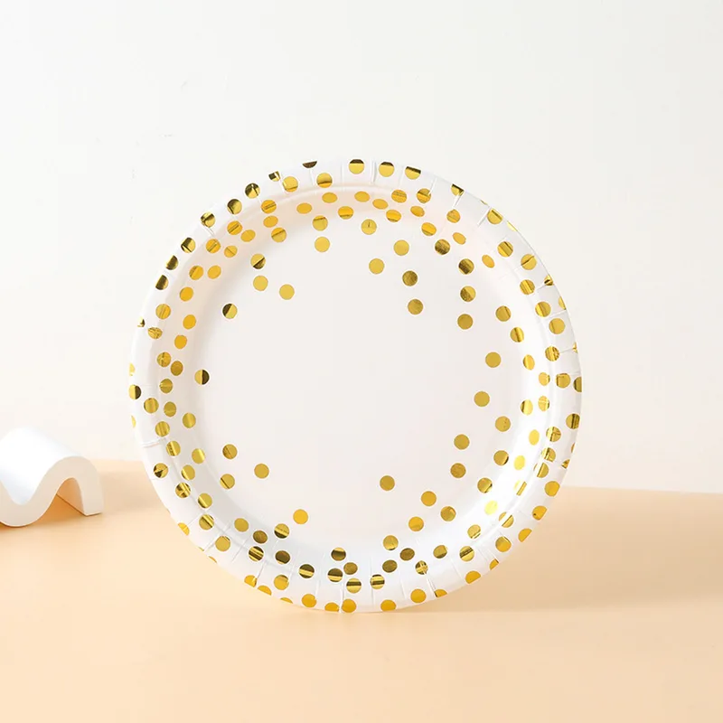 White paper plate with gold foil dots
