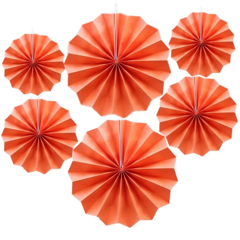 Six orange paper fans in assorted sizes